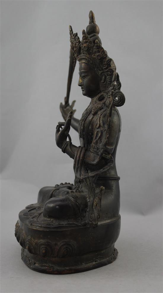 A Sino-Tibetan bronze seated figure of Manjushri, 31cm